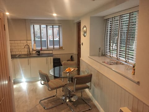 Wooden blinds at the windows allow privacy with lots of natural light