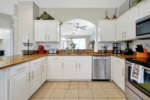 Open concept kitchen with views to lounge and family room and pool!