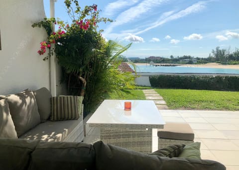 Private back patio-ocean view. Steps from western pool, dock & sundeck & ocean.