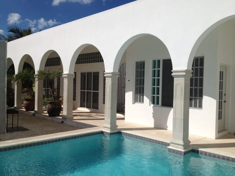 Poolside.  The apartment is on the left side of the photo.