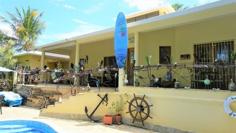 VIEW FROM POOL TO UPPER TERRACE AND BBQ