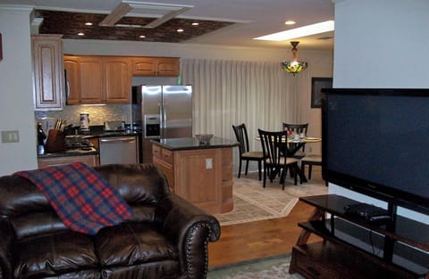 Living room with view of Kitchen and Dining area