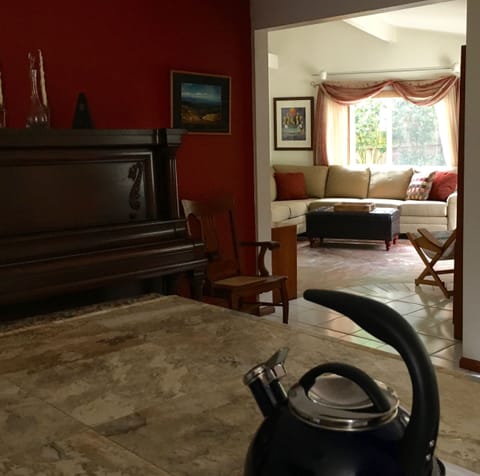 View from the kitchen into the sunny family/TV room.