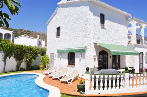 Suncatching poolside terrace with sun beds