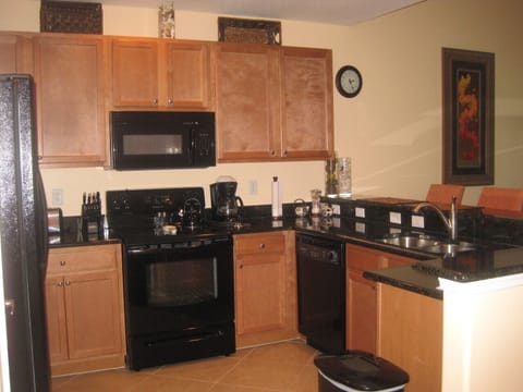 Fully upgrade kitchen with granite countertops, all appliances & breakfast bar.