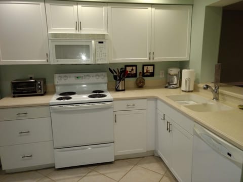 Open kitchen with all the amenities, well stocked for the family chef!