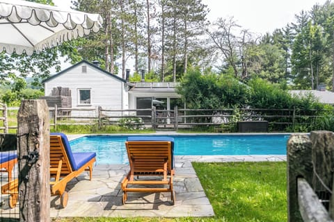 Serene 40x20 heated saltwater pool behind the guest cottage