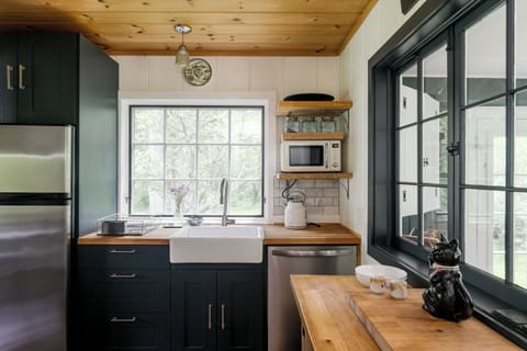 Kitchen equipped with coffee maker, electric kettle, toaster and ninja blender
