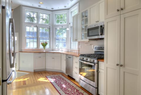 The fully stocked gourmet kitchen with plenty of natural light.

