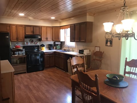 Cedar Breeze has a fully equipped kitchen with cozy dining area.