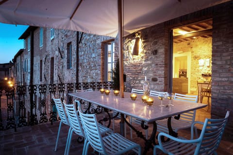 The terrace with outdoor dining table at dusk
