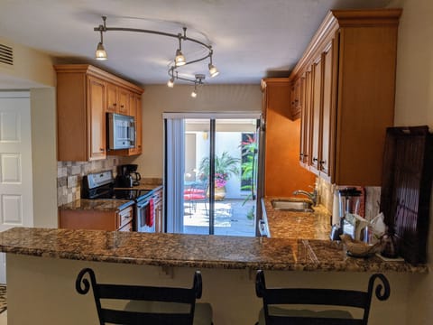 Countertop seating is available along with  sliding door access to the courtyard