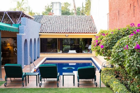 Pool from garden looking towards living room window
