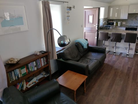 24 ft open plan lounge/kitchen with breakfast bar.