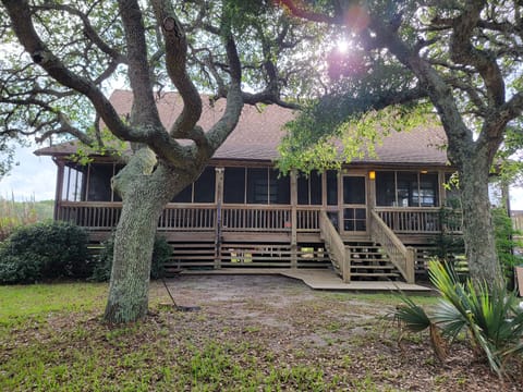 Welcome to the Hidden Gem! In front- outdoor shower + screened wraparound porch