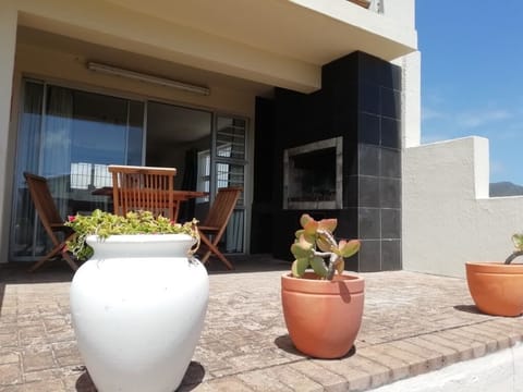 Built in braai/BBQ under roof. Next to dining room. 