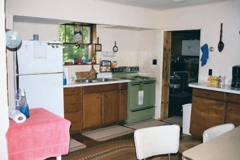 Kitchen with electric range and full size refrigerator plus misc small appliance