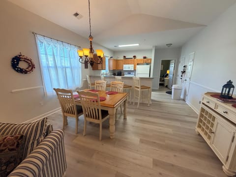 Dining table seats 4, plus 4 at the bar