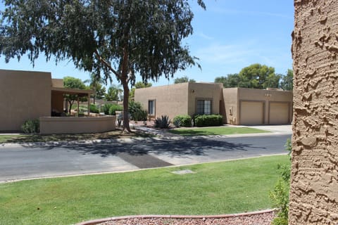 Front of house with path to pool