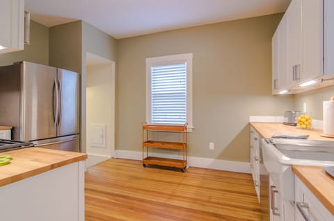 View of the kitchen from the hallway near the sunroom.