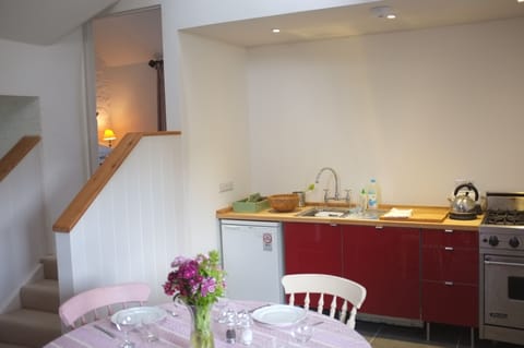 Kitchen, and steps up to ensuite bedroom