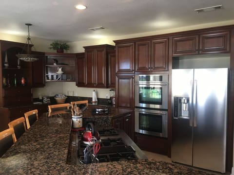 6 burner Jenn-Air gas downdraft. Jenn-Air double convection ovens, LG fridge. 