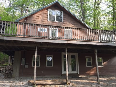 House settled back in Private Drive and Partial Lake Views, Beach near driveway