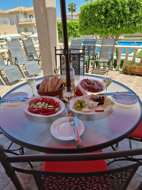 Lunch under the sun shade with pool views