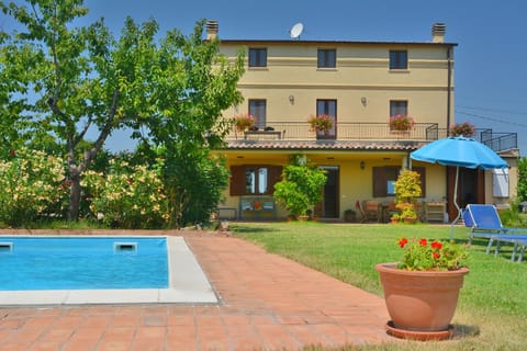 A 4 bedroom house with a private garden with a pool & parking area