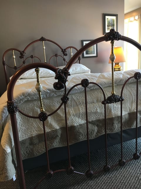 Sweet dreams in this queen size ornate iron bed.
