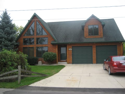 Front of Cabin-Lodge Home, most of home surrounded by Water.
