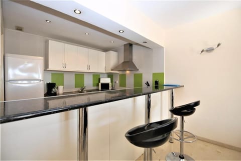 View of the kitchen from the modern breakfast bar