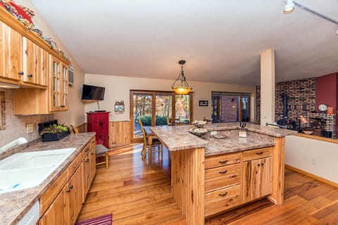 Open kitchen looks right out to the patio and lake