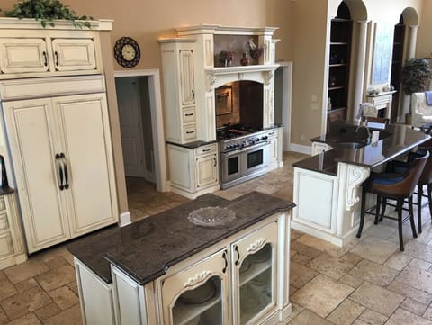 Large upstairs kitchen with two sinks, two ovens, two dishwashers, and more.
