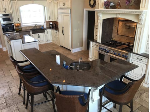 Breakfast bar area of upper level kitchen.