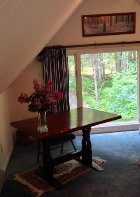 Table/chair in corner of master bedroom