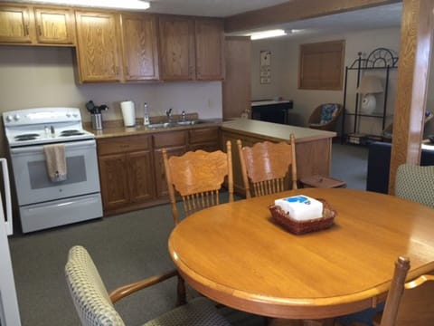 Kitchen/Dining room. Oak cabinets. Electric stove, microwave.