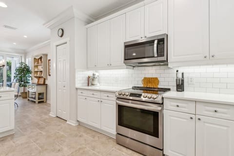 Fully Equipped Luxury Kitchen with Stainless Steel Appliances and Stunning Quartz Countertops
