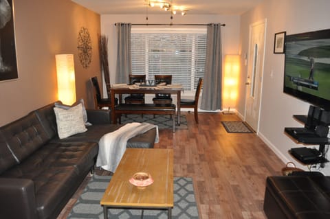 Open Concept Living/Dining Room 55'' Smart Plasma TV and Top Grain Leather Sofas