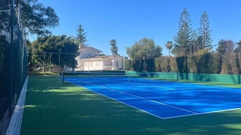 tennis court with view to house