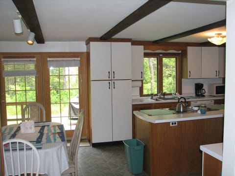 Kitchen with view of backyard deck