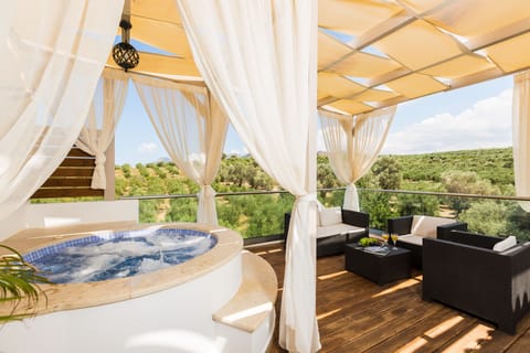 The large balcony is equipped with an outdoor whirlpool and wooden deck!