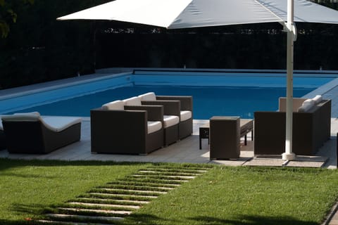 sofa set by the pool
