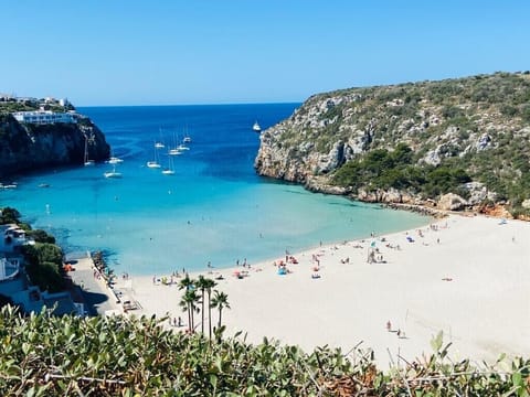 Cala N Porter local beach. It's not the house view but 3 min by car, 20' on foot
