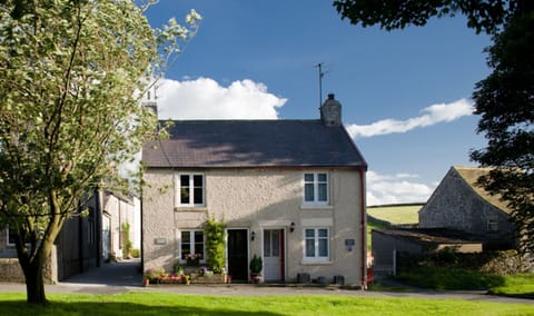Candlelight Cottage looks over the picturesque village green.