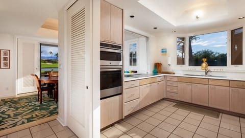 Fully stocked kitchen with essential cookware, spices and oils