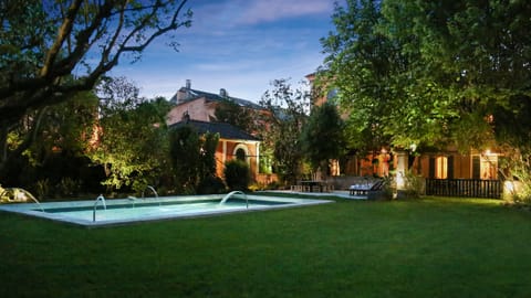 Swimming pool and garden in the evening