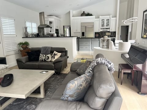 View of TV and kitchen