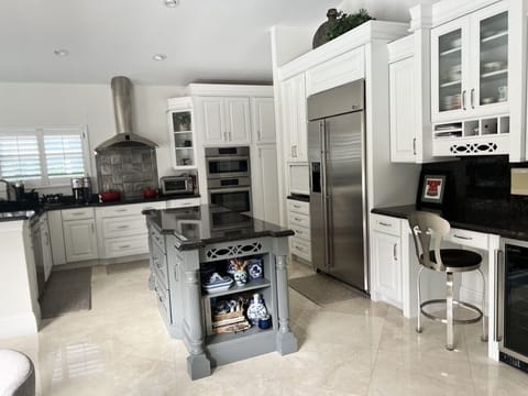 A kitchen that’s filled with pots, pans, utensils, spices, etc. etc. etc.