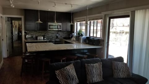 Large kitchen. Dishwasher, 2 induction cooktops, microwave w oven, large fridge